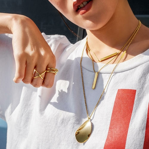 Gold Skinny Crisscross Band Ring featuring a slim, intertwined gold design, perfect for everyday wear and special occasions.
