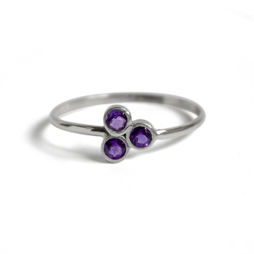 Amethyst Cluster Sterling Silver Ring with a vibrant purple amethyst gemstone set in a polished sterling silver band.