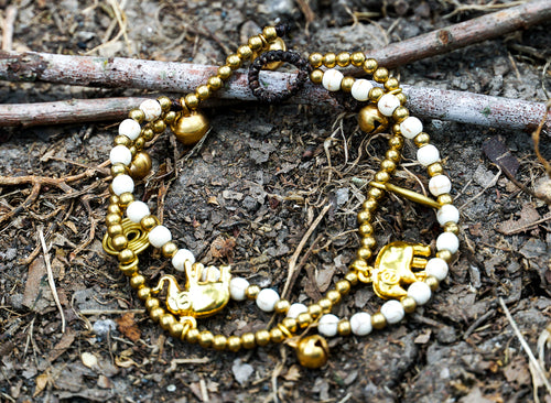 Boho Elephant Bracelets in brass with white accents, stylish accessories suitable for casual or bohemian outfits.