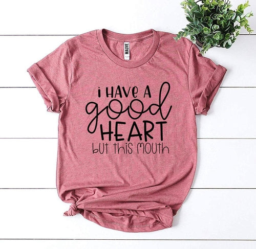 I Have a Good Heart But This Mouth T-shirt in white cotton with bold black text, casual everyday wear.