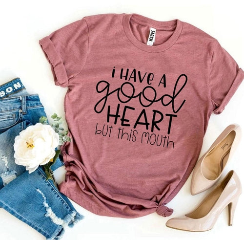 I Have a Good Heart But This Mouth T-shirt in black cotton with bold white text, casual wear for everyday comfort.