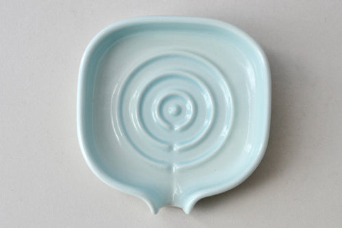 Self-Draining Porcelain Soap Dish in white with drainage holes to keep soap dry and clean.