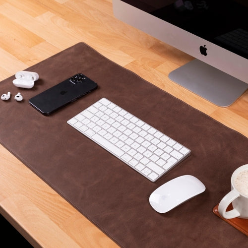 Rawlins Leather Desk Pads in brown, available in 36x19 and 14.6x31.5 inches, made of genuine leather for workspace protection and style.